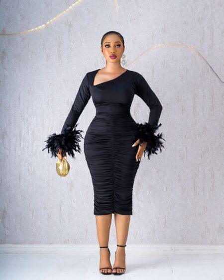 BLACK RUCHED DRESS WITH FEATHERS