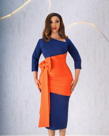 NAVYBLUE AND ORANGE BOW DRESS