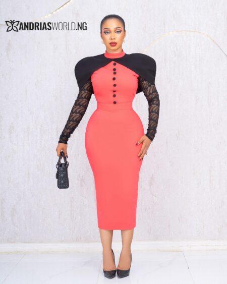 ORANGE AND BLACK CAPE DRESS WITH LACE SLEEVES