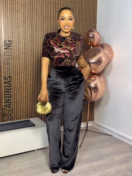 Black velvet jumpsuit with sequin multicolored cape