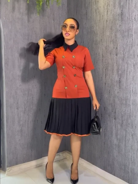 Orange and black pleated dress